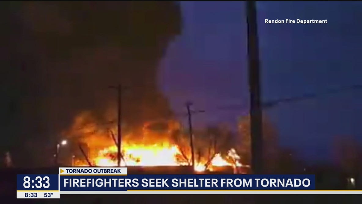 Tornado threatens firefighters battling wooden pallet fire